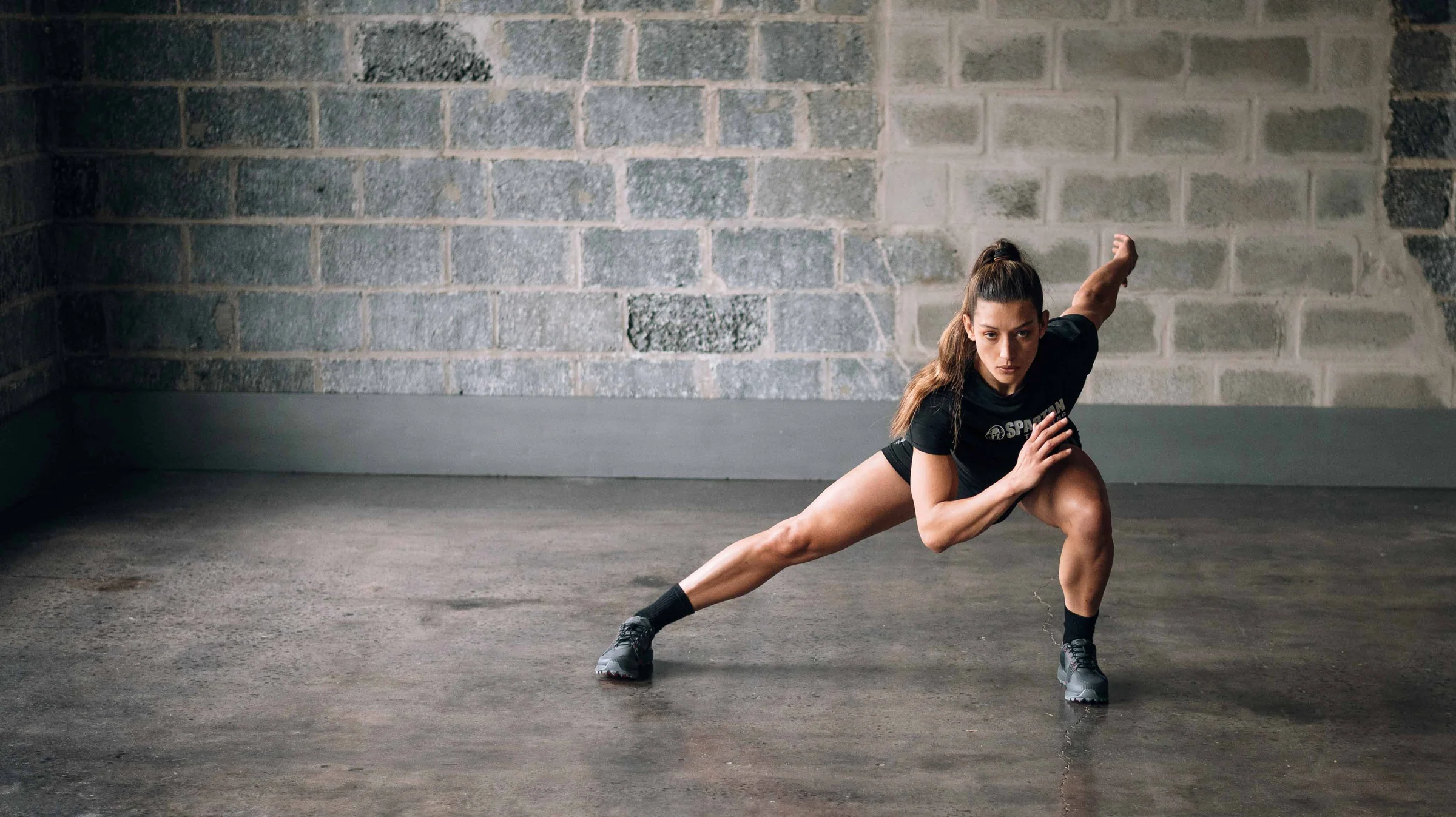 Lower-body training posture shown with neutral lighting